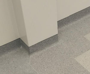 Floormitres, cove formers and capping strips for hospital floors