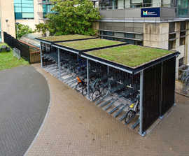 Green roof cycle shelter and 2-tier bike racks for university