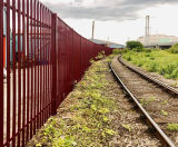 Steel palisade fencing secures timber business perimeter - on this page