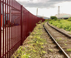 Steel palisade fencing secures timber business perimeter