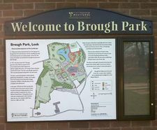 Park entrance sign with map and noticeboard - Brough Park