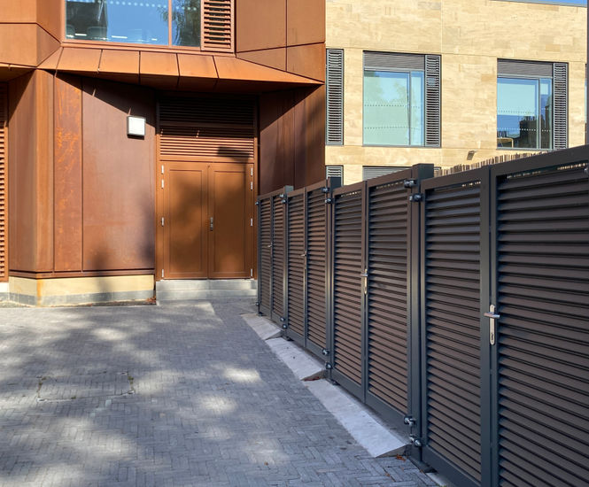 Waste / recycling bin stores and railings for primary school
