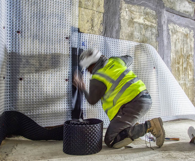 Basement waterproofing for 21 community houses