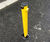 Yellow lockable fold-down steel post for driveways and parking spaces 1