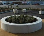 Roosevelt - round precast concrete outdoor planter for public spaces