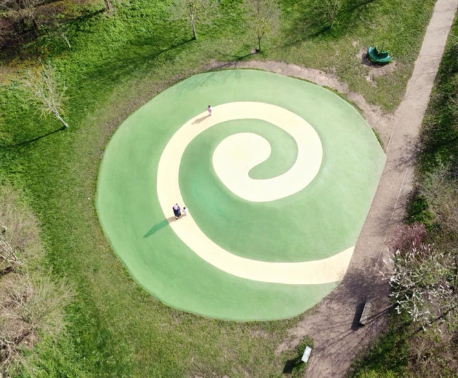 Vibrant safety surfacing for Venusberg mound - Cedars Park