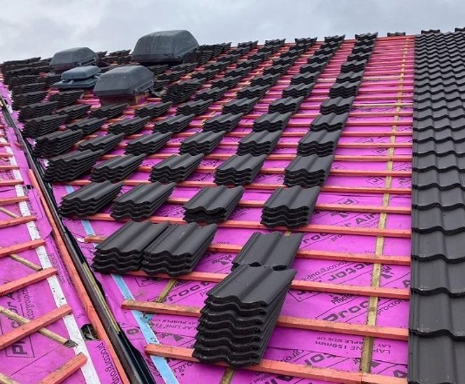 Breather membranes for re-roofing of occupied apartment building