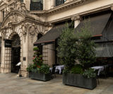 Bespoke movable bronze barrier planters for restaurant - on this page