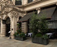Bespoke movable bronze barrier planters for restaurant