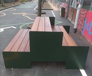 Bespoke iroko and steel tiered seating for leisure centre - London