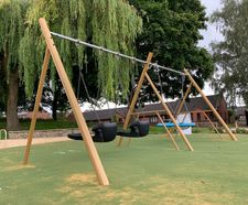 Timber-effect, steel-framed swing for park refurbishment