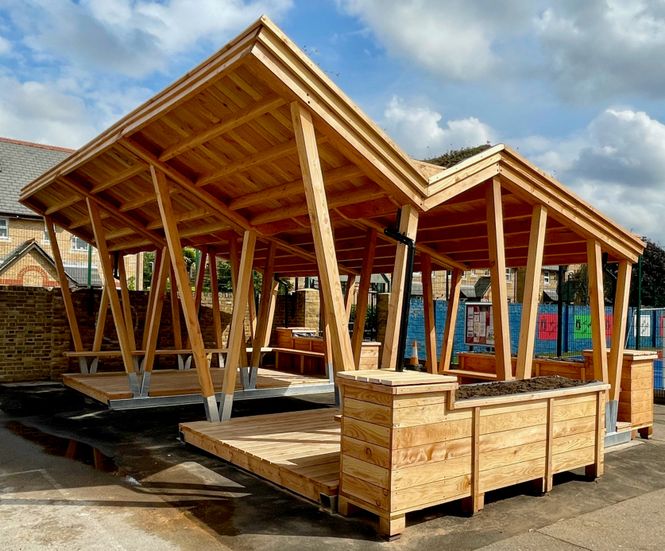 Playground shelter, stage and meeting space for primary school