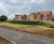 Earth reinforced retaining walls for attenuation ponds 0