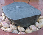 Sawn boulder bubbling water feature