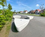 Outdoor seating and bins for new housing estate's community space - on this page