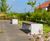 Outdoor seating and bins for new housing estate's community space 8