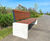 Outdoor seating and bins for new housing estate's community space 7