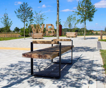 Rustic timber seating and picnic sets for new community