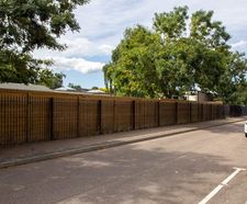 Acoustic barrier provides noise reduction and privacy for school