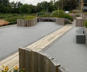 Porous resin bound surfacing for luxury apartment complex