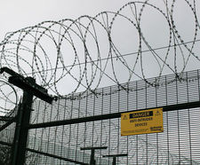Barbed tape and wire wall / fence / gate topping
