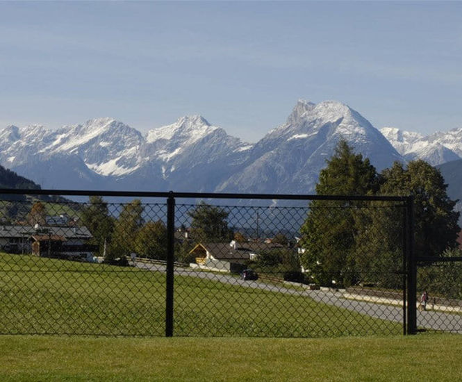 Tubular fencing systems for chain linked and welded mesh