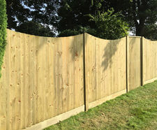 Concave featherboard fencing panels