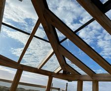 Rafterline patent glazing system for timber-framed roofs