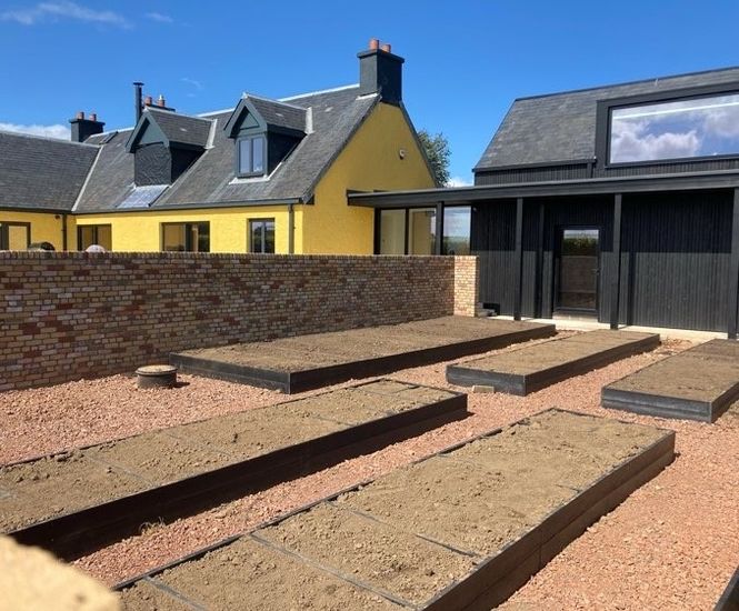 Recycled plastic raised planting beds for landscape gardener