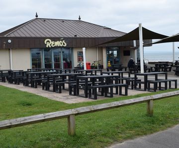 Eco-friendly recycled plastic picnic tables for beachfront cafe