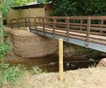 Concrete filled bagwork for revetments