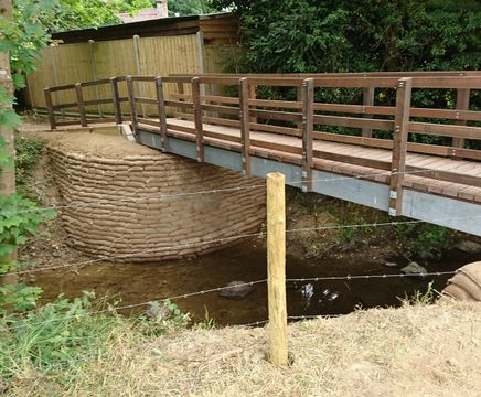 Concrete filled bagwork for revetments