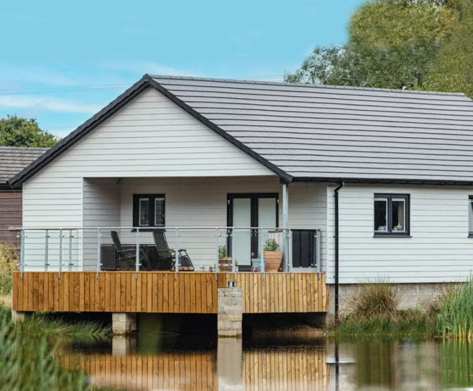 Weatherboard cladding and Edgemere roofing for charity building