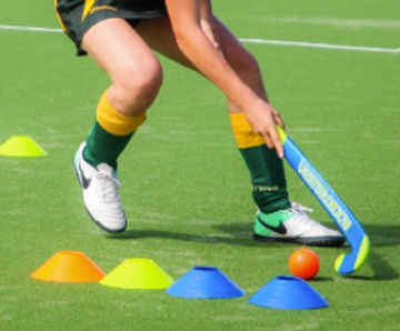 Synthetic hockey pitch surfacing