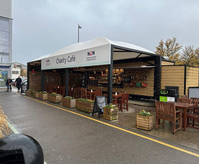 Canopies protect customers at hospital's outdoor charity cafe