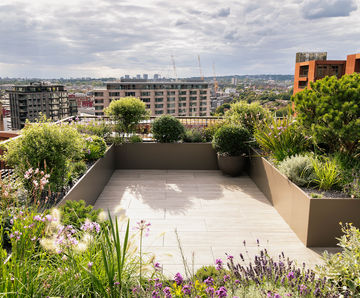 Planters, seating and floor tiles for fire-rated roof terrace