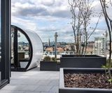 Fire-rated adjustable pedestals support paving on roof terrace - on this page