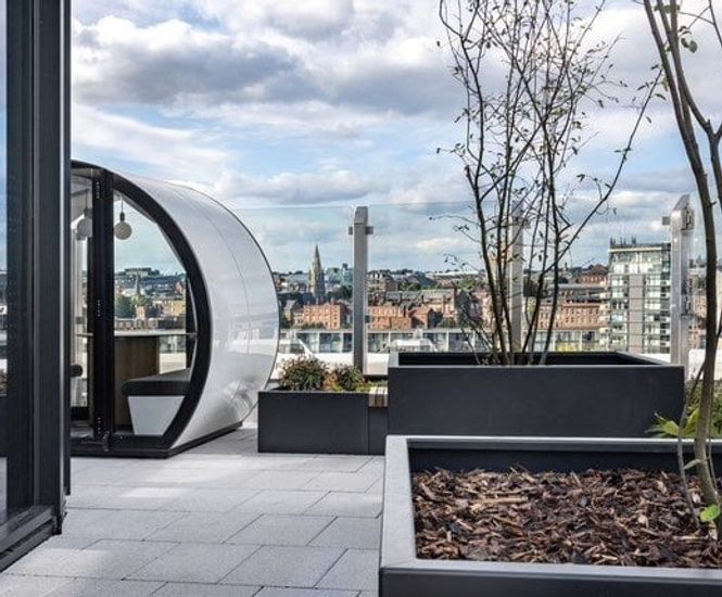 Fire-rated adjustable pedestals support paving on roof terrace