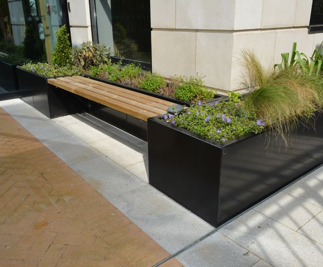 Stratum planters with seating for commercial courtyard