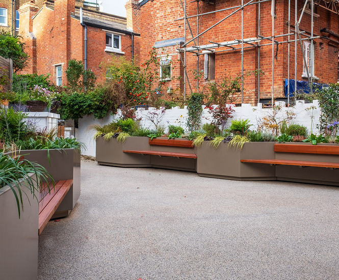 Large bespoke illuminated steel planter / benches for office courtyard