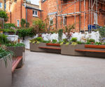 Large bespoke illuminated steel planter / benches for office courtyard