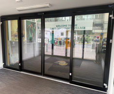 Door drives automate bi-parting sliding doors at sports village entrance