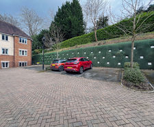Construction anchors secure failing timber crib retaining wall