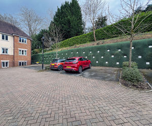 Construction anchors secure failing timber crib retaining wall