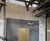Durable, wind-loaded, custom-branded screen for distillery site separation 3