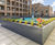 Steel planters and hardwood seating for new residential development 12