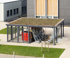 Hybrid sedum-roofed cycle shelter and bin store - Southmead Hospital
