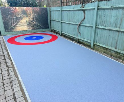 Bespoke bowling-themed resin bound surfacing for adult support centre