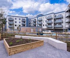 Modular concrete and timber outdoor seating for housing development - Cork