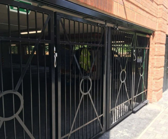 CSG 10607 Bi-Folding Overhead Tracked Gate - steel security gate